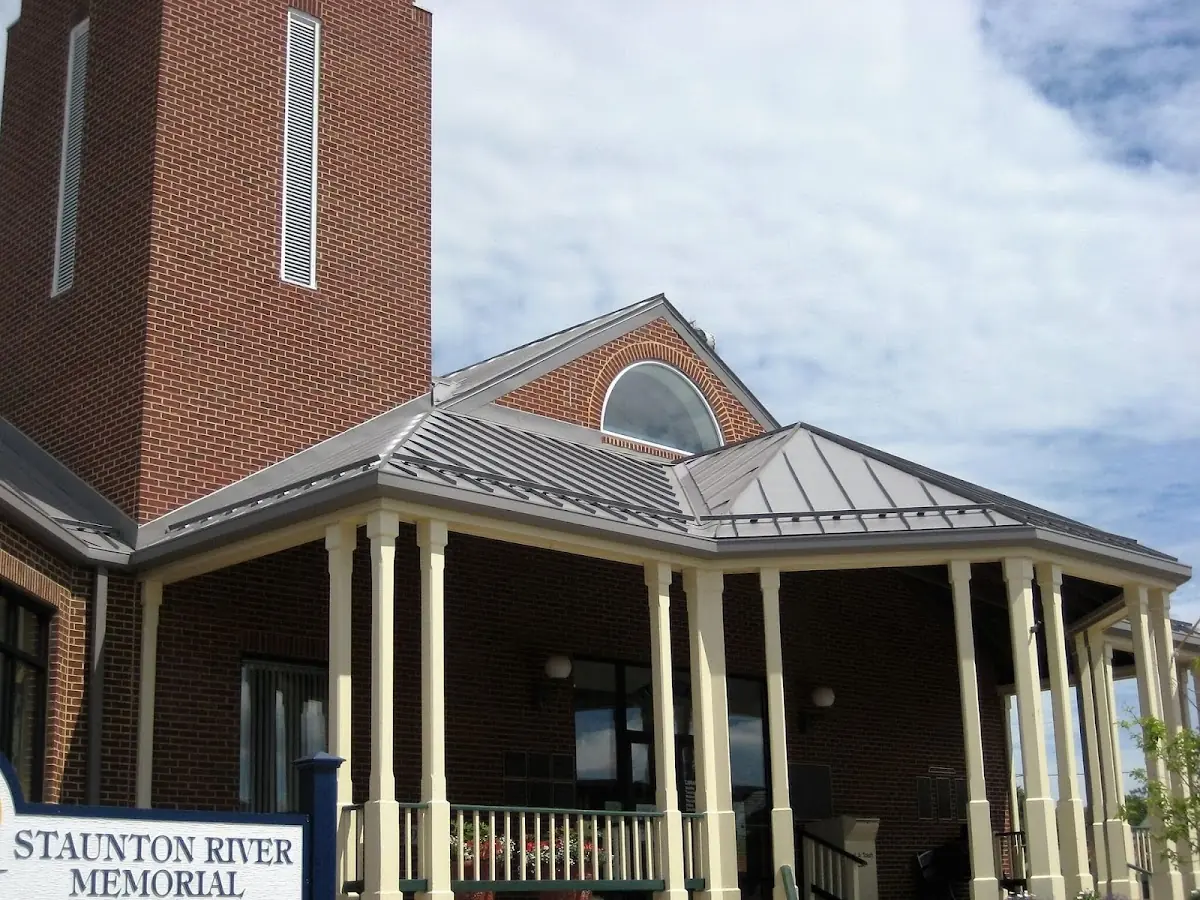 Skilled roofing craftsmen working on a residential roof in Buckeye